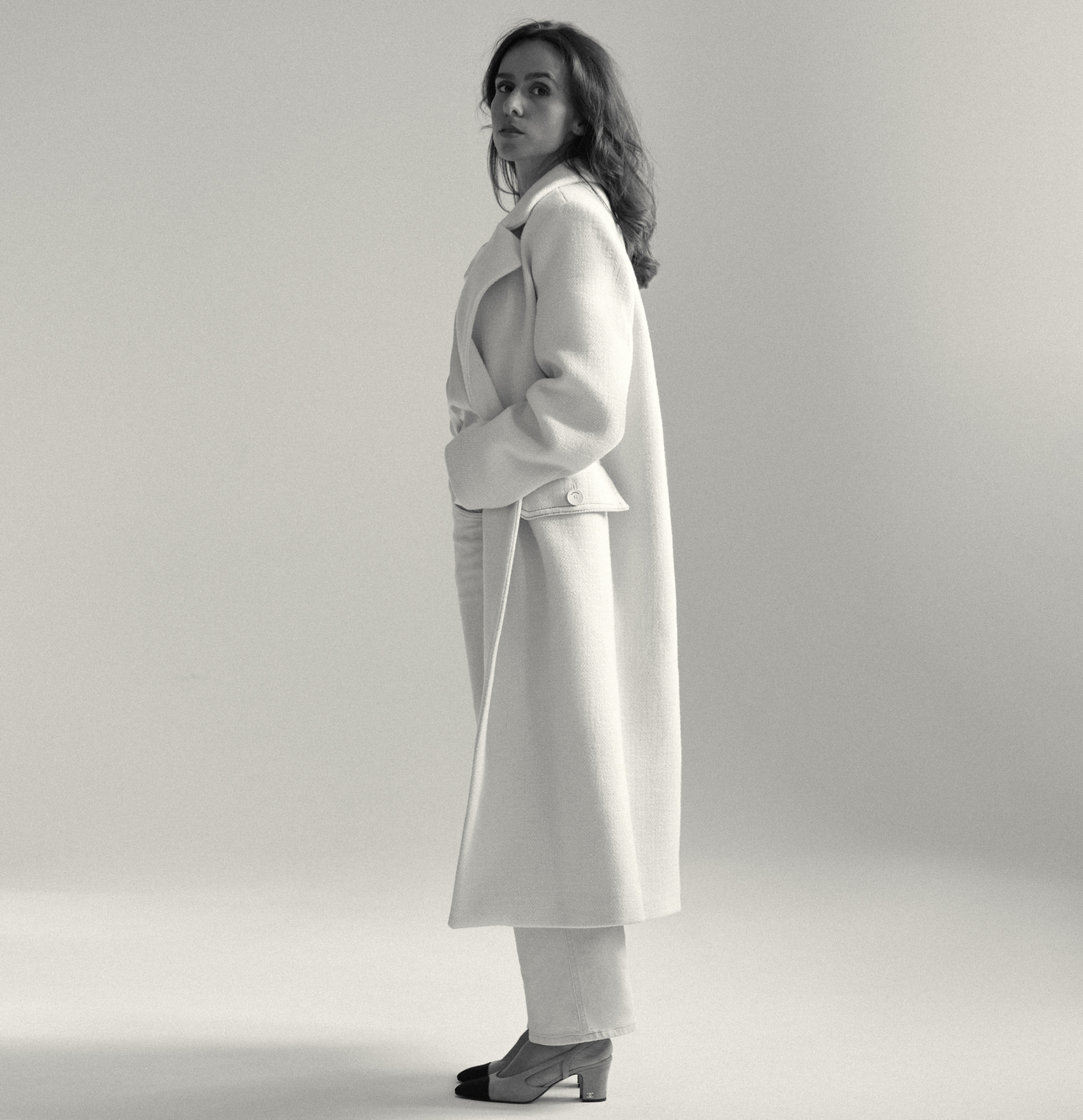 woman in white coat black and white